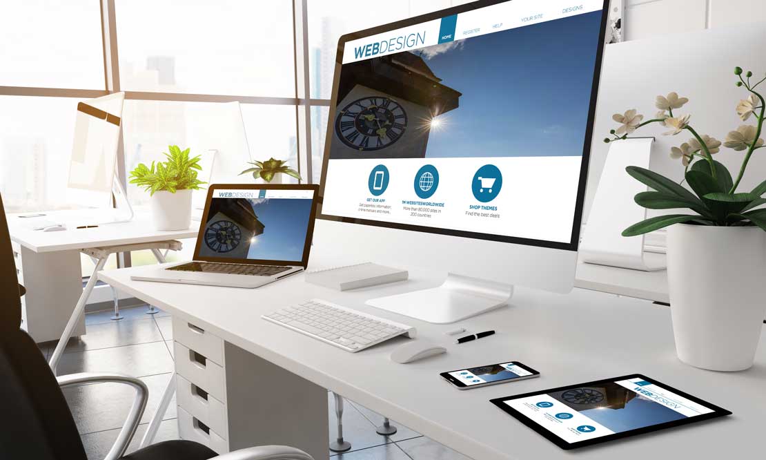 Webdesign Screens mit Uhrturm Graz, iMac, iPad, iPhone